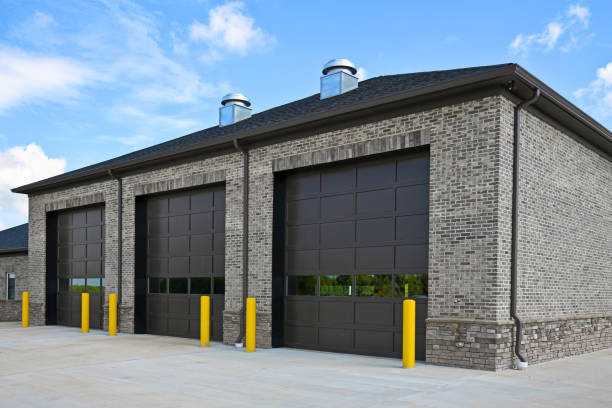 an new brick commercial building with three large garage doors